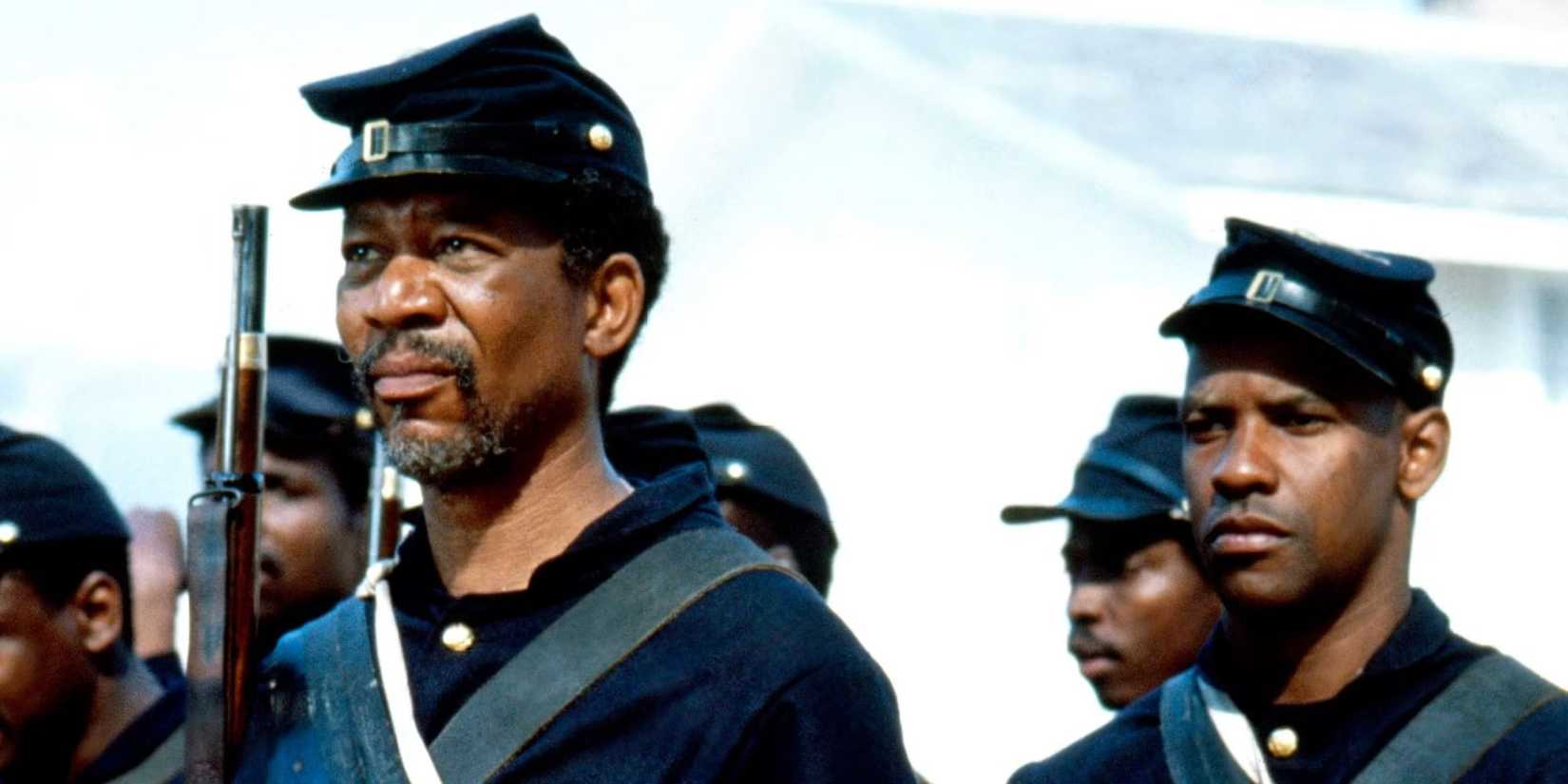 Morgan Freeman and Denzel Washington as soldiers standing in ranks looking serious in Glory.
