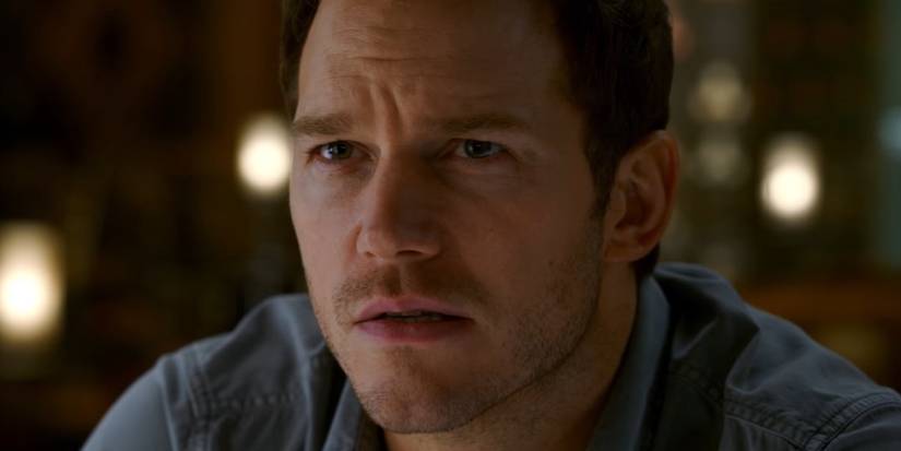 Chris Pratt in Passengers sitting at the bar, pensive