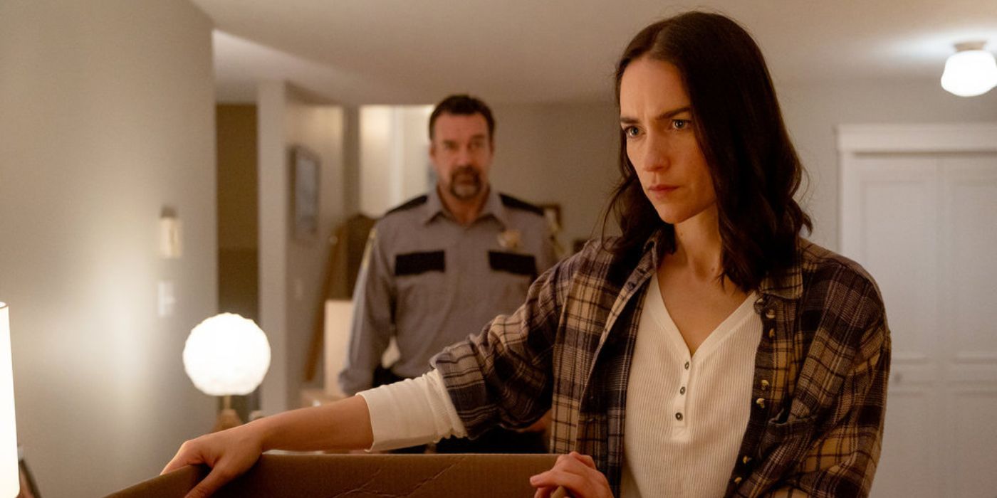 Melanie Scrofano holding a box of belongings in Revival