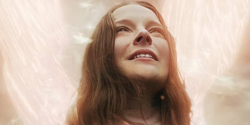 Morfydd-Clark as Maud smiling and looking up in Saint-Maud