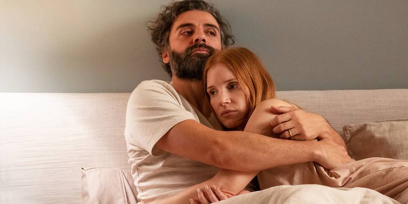Oscar Isaac hugging Jessica Chastain in bed in Scenes From a Marriage 