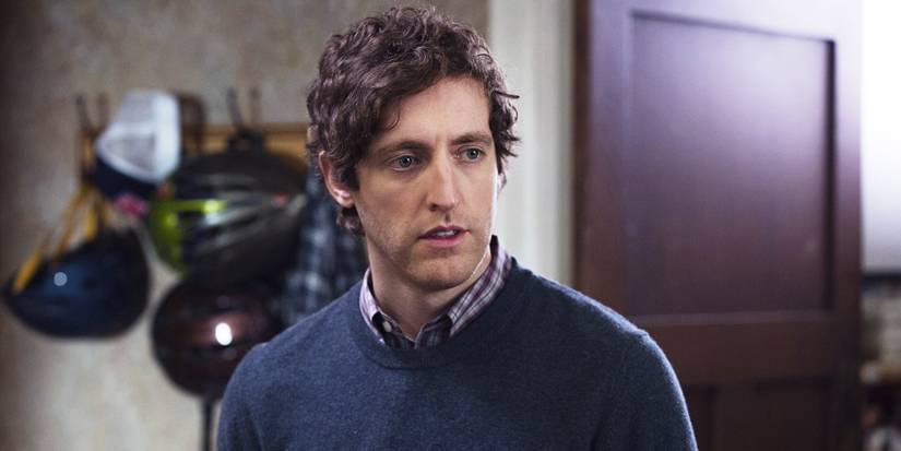 Richard standing in a room and looking to the side with bike helmets in the background in Silicon Valley.