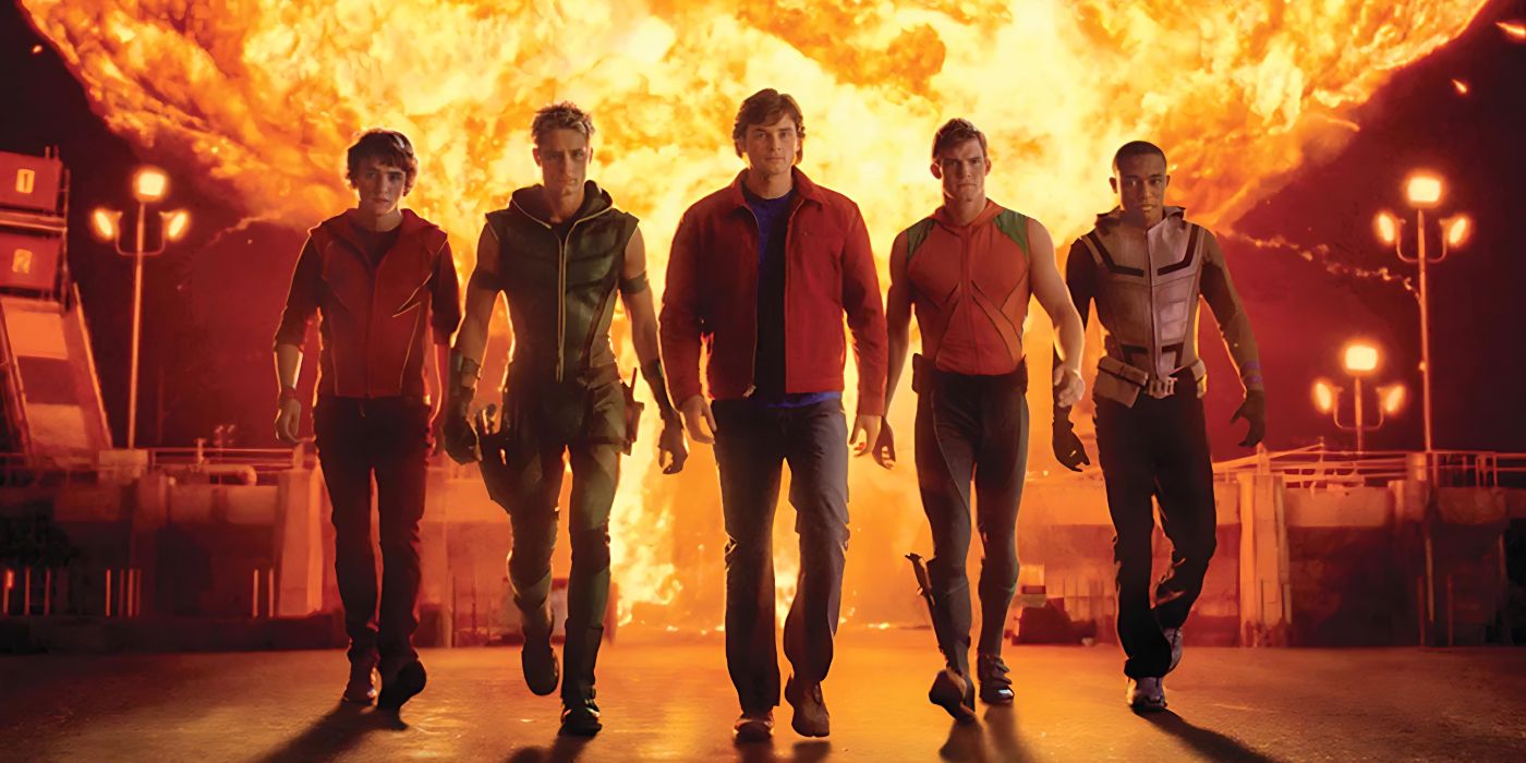 Bart Allen, Oliver Queen, Clark Kent, Arthur Curry, and Victor Stone walk away from an explosion in Smallville.