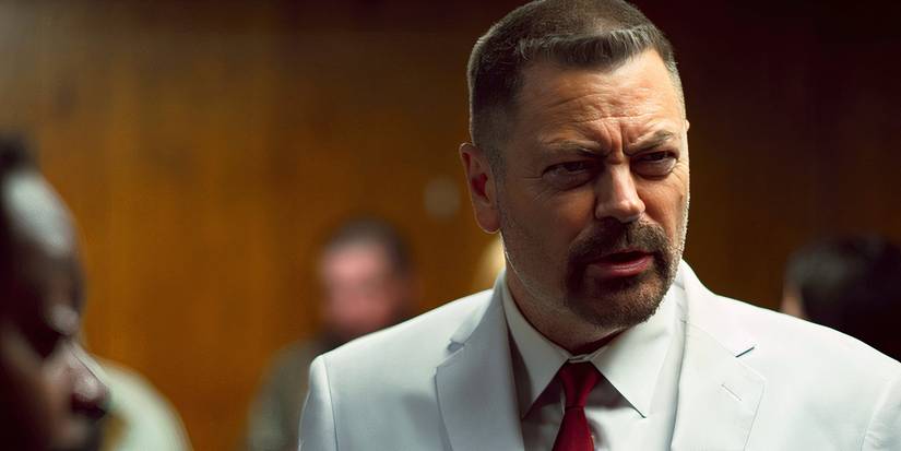 Nick Offerman wearing a white suit, scowling, in a wood-paneled room in Sovereign