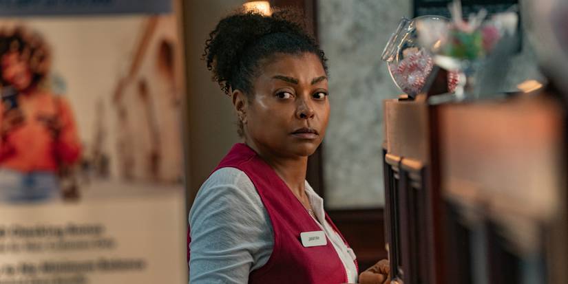 Taraji P. Henson as Janiyah working in her red uniform, staring at camera in Straw.