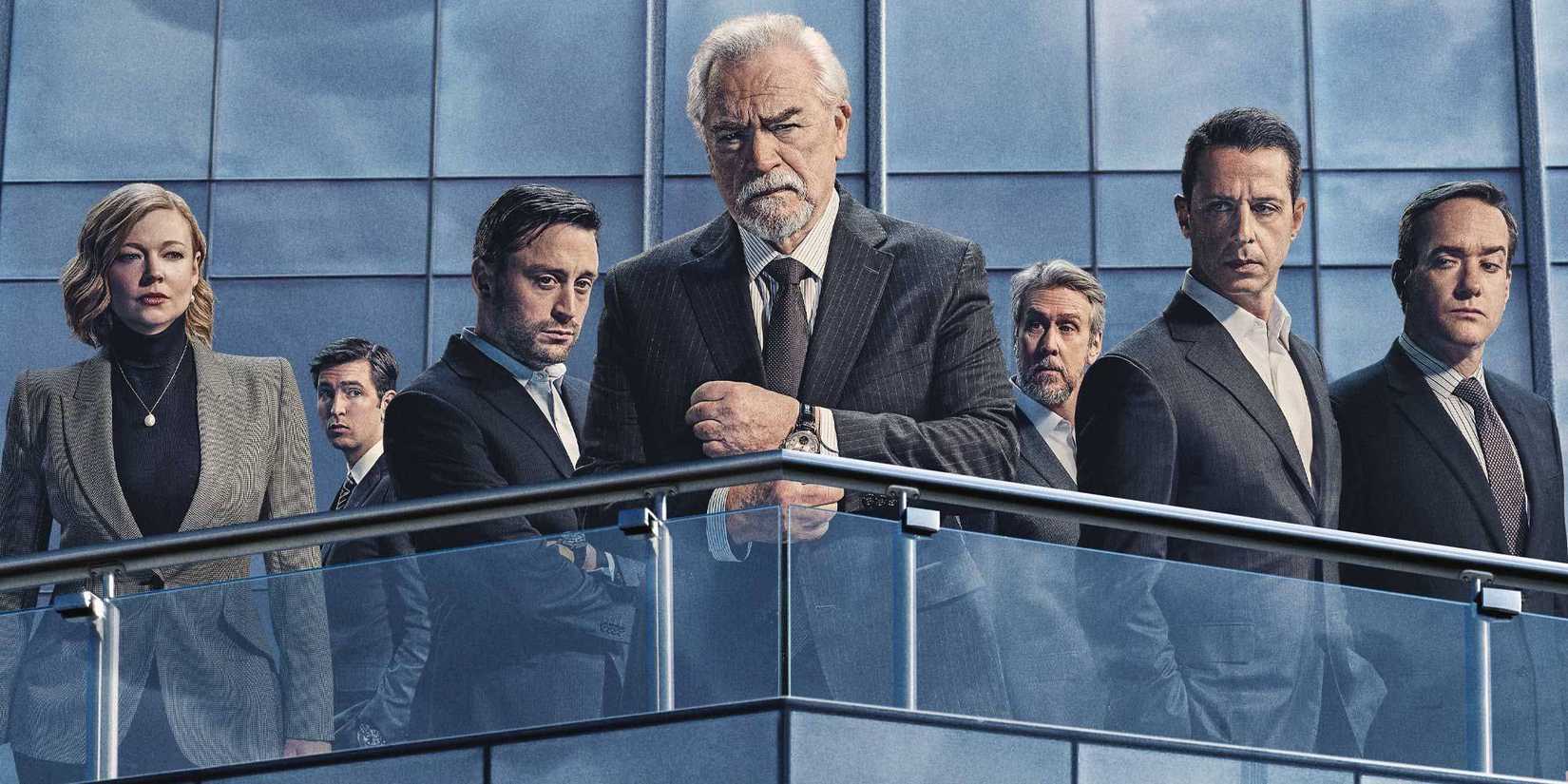 The cast stand on the balcony of a high-rise building in a poster for Succession season 4.