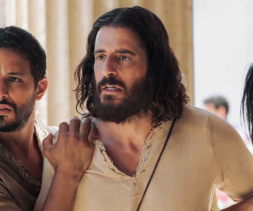 Jesus gets held back from helping by two other men in The Chosen