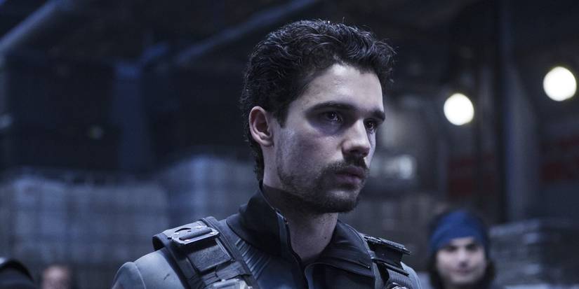 Strait as James Holden looking just off-camera and serious in The Expanse.