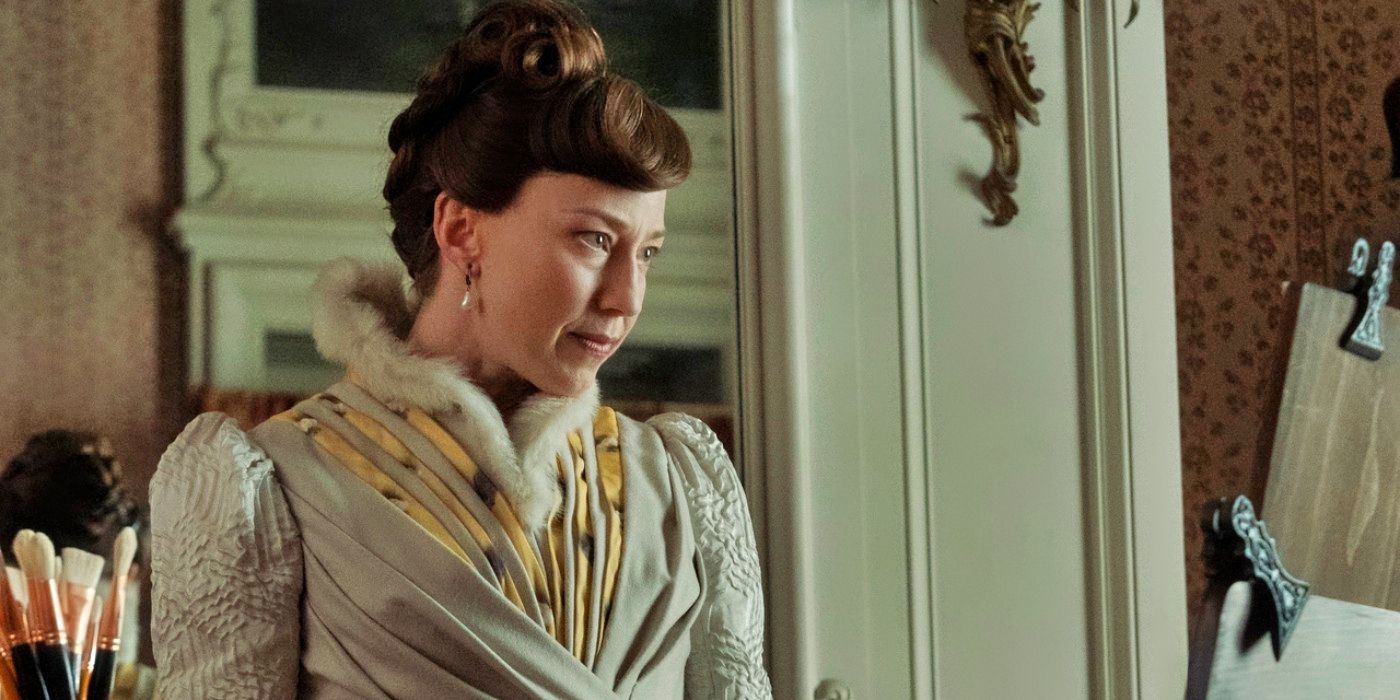 Carrie Coon looking at a portrait in progress in The Gilded Age.