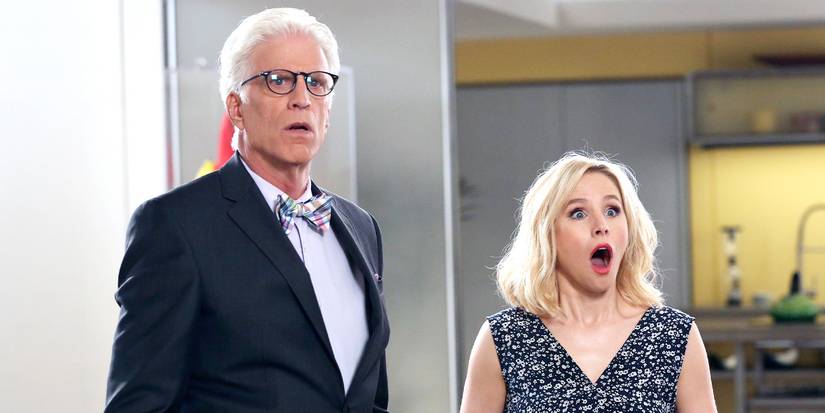 Kristen Bell has her mouth open in shock as she stands next to Ted Danson in 'The Good Place.'