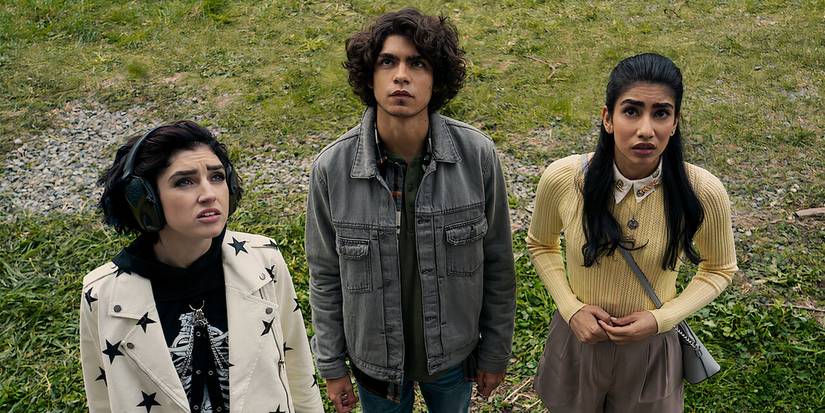 The three protagonists in the Netflix Original The Imperfects staring slightly upwards in bewilderment.