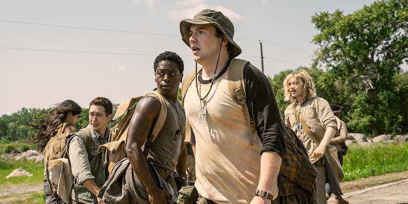 Cooper Hoffman, David Jonsson, and other competitors fearfully look behind them in The Long Walk