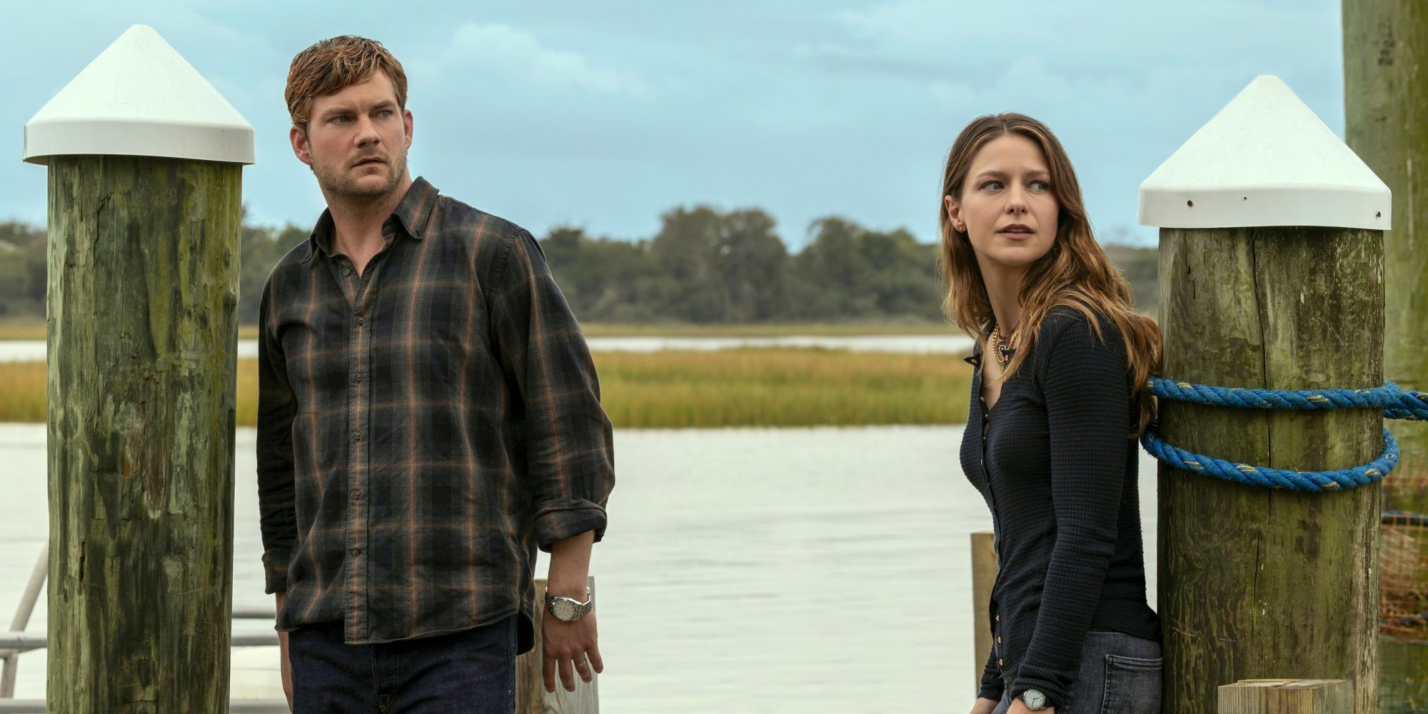 Jake Weary as Cane standing outside on the dock with Melissa Benoist as Bree in The Waterfront