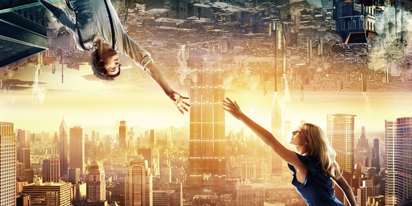 Jim Sturgess and Kirsten Dunst reaching out for each other from oposite sides of a banner in Upside Down