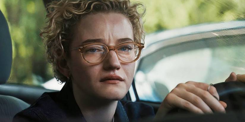 Julia Garner wears thick framed glasses and cries in an image of 'Weapons.'