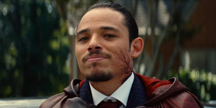 Anthony Ramos smirking with virus-like veins up his neck in Ironheart