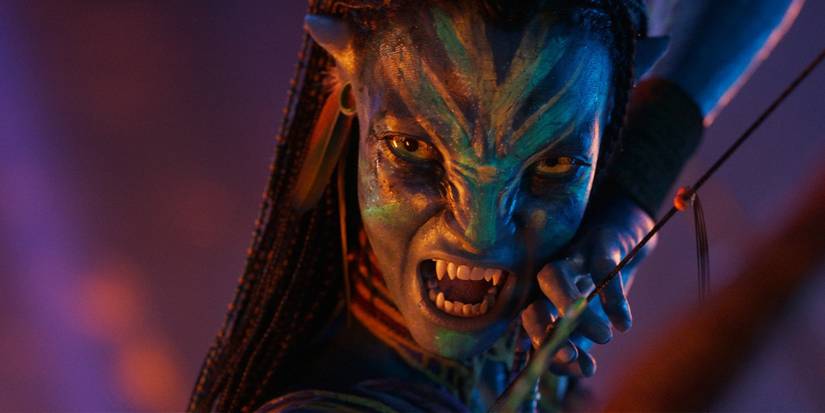 Avatar fire and ash  - a Na'vi warrior aiming a bow and snarling