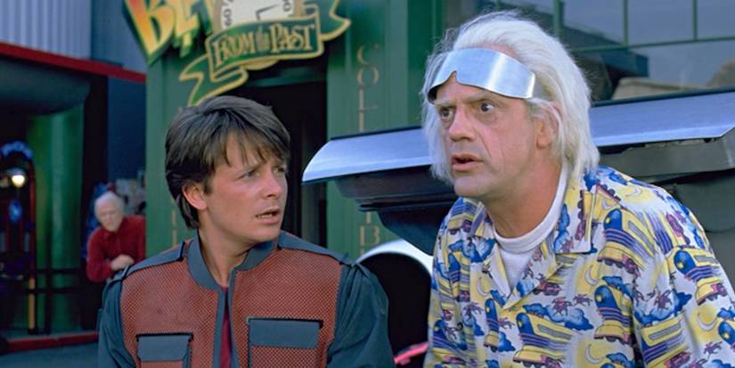 Michael J. Fox and Christopher Lloyd as Marty and Doc, with Marty looking at Doc with concern in 'Back to the Future'.