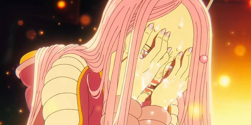 Bonney crying into her hands in One Piece