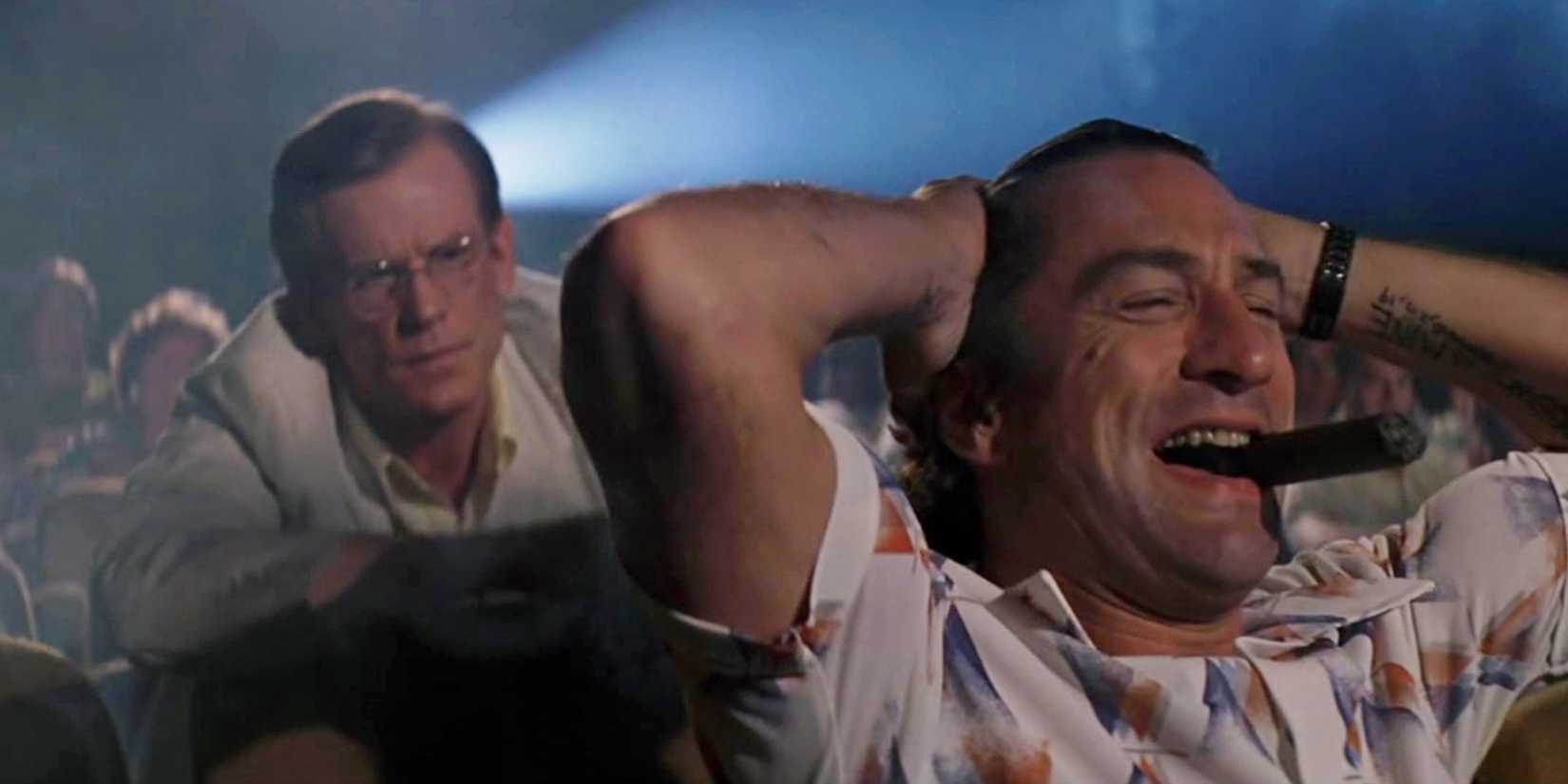 Robert De Niro laughing and annoying Nick Nolte in a cinema in Cape Fear (1991)