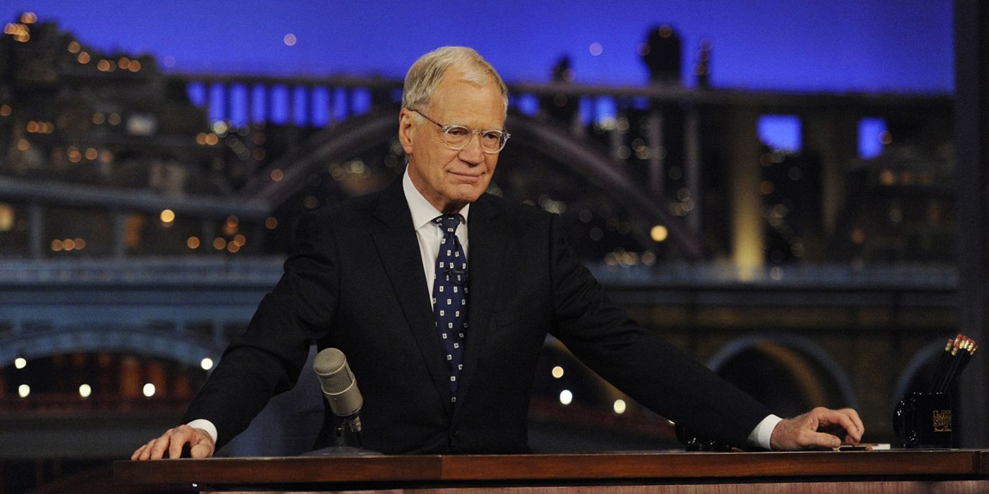 David Letterman behind his desk in Late Night with David Letterman.