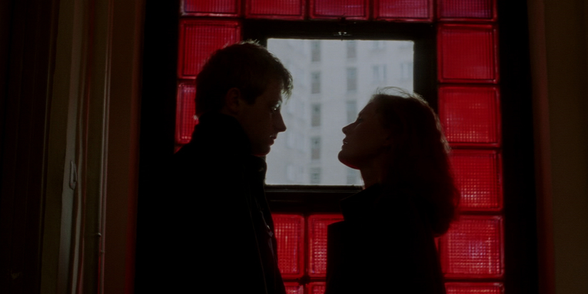Tomek (Olaf Lubaszenko) and Magda (Grażyna Szapolowska) stare at each other in a silhouette in the 'Dekalog' episode "Six," also called 'A Short Film About Love'