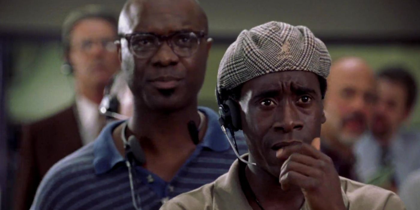 Don Cheadle on a headset looking worried in Volcano