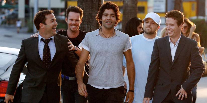 Aiden Grenier as Vincent grins walking in Los Angeles with his three friends and his agent in Entourage.
