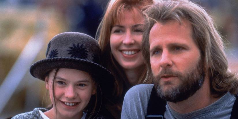 Jeff Daniels, Anna Paquin, and Dana Delany looking to the distance and smiling in Fly Away Home.