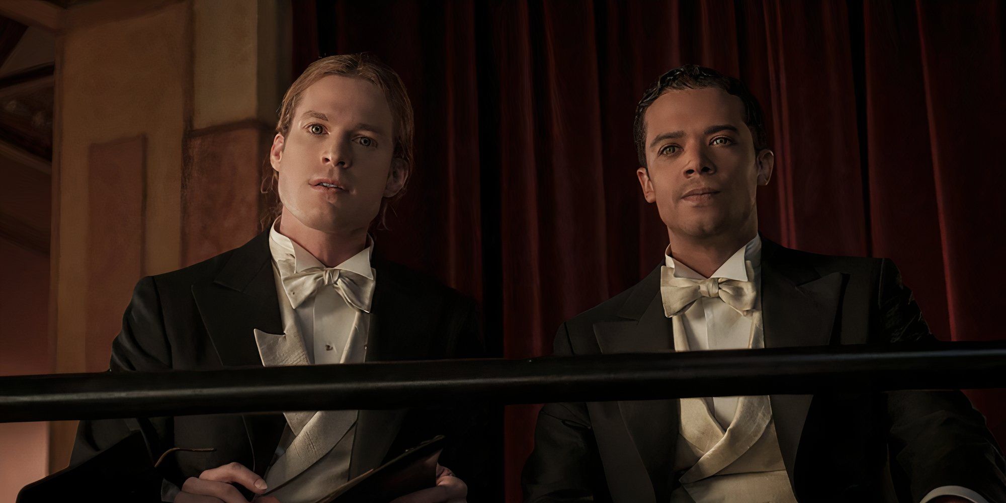 Interview with the Vampire Louis and Lestat, sitting and staring down at the stage. 