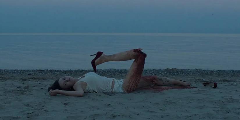 A mutilated woman on the beach in It Follows
