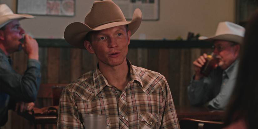 Jefferson White as Jimmy sitting in a bar wearing a cowboy hat in Yellowstone, No Kindness for the Coward.