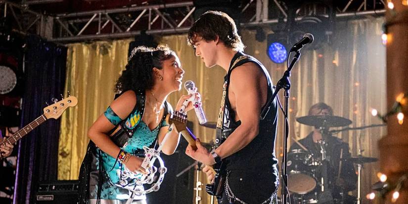 Julie Molina and Luke Patterson singing onstage together in Julie and the Phantoms.