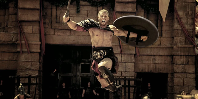 Seorang pria dengan pedang dan perisai melompat