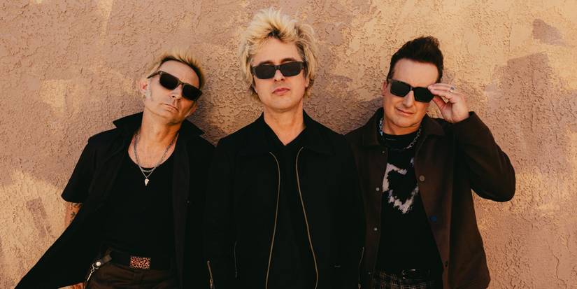 Mike Durnt, Billie Joe Armstrong, and Tre Cool posing for a Green Day profile shot.