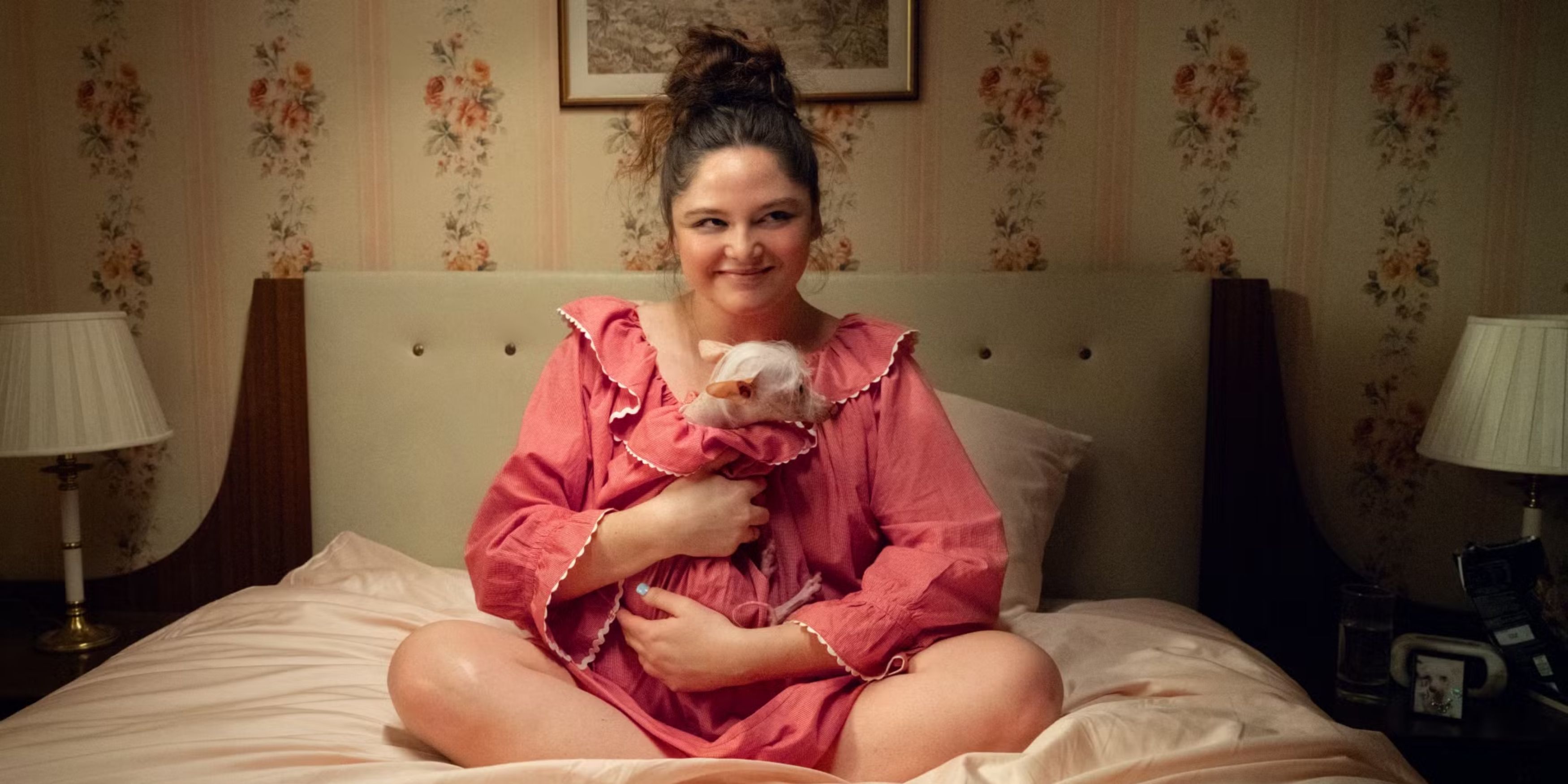 Meg Stalter holding dog in Too Much