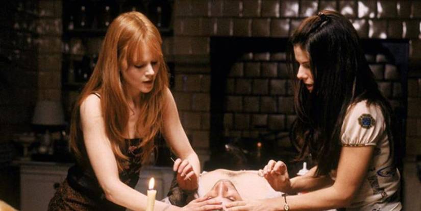 Sandra Bullock and Nicole Kidman do magic on a dead body in Practical Magic