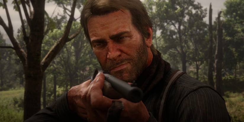 Arthur Morgan holds a gun in 'Red Dead Redemption II'