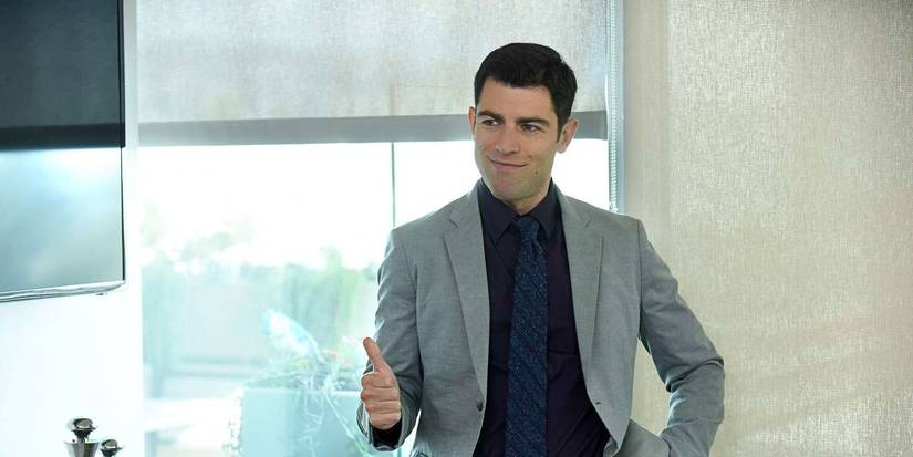 Schmidt wearing a suit and giving a work presentation in New Girl Season 6.