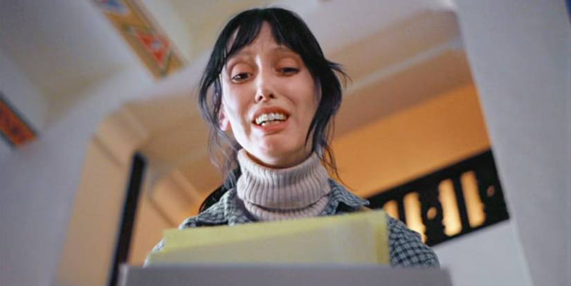 Shelley Duvall as Wendy, looking at a typewriter in fear in The Shining (1980)
