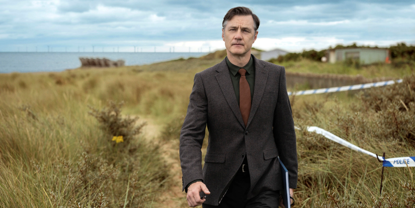 David Morrissey as DCS Ian St Clair walks through a field in Sherwood.