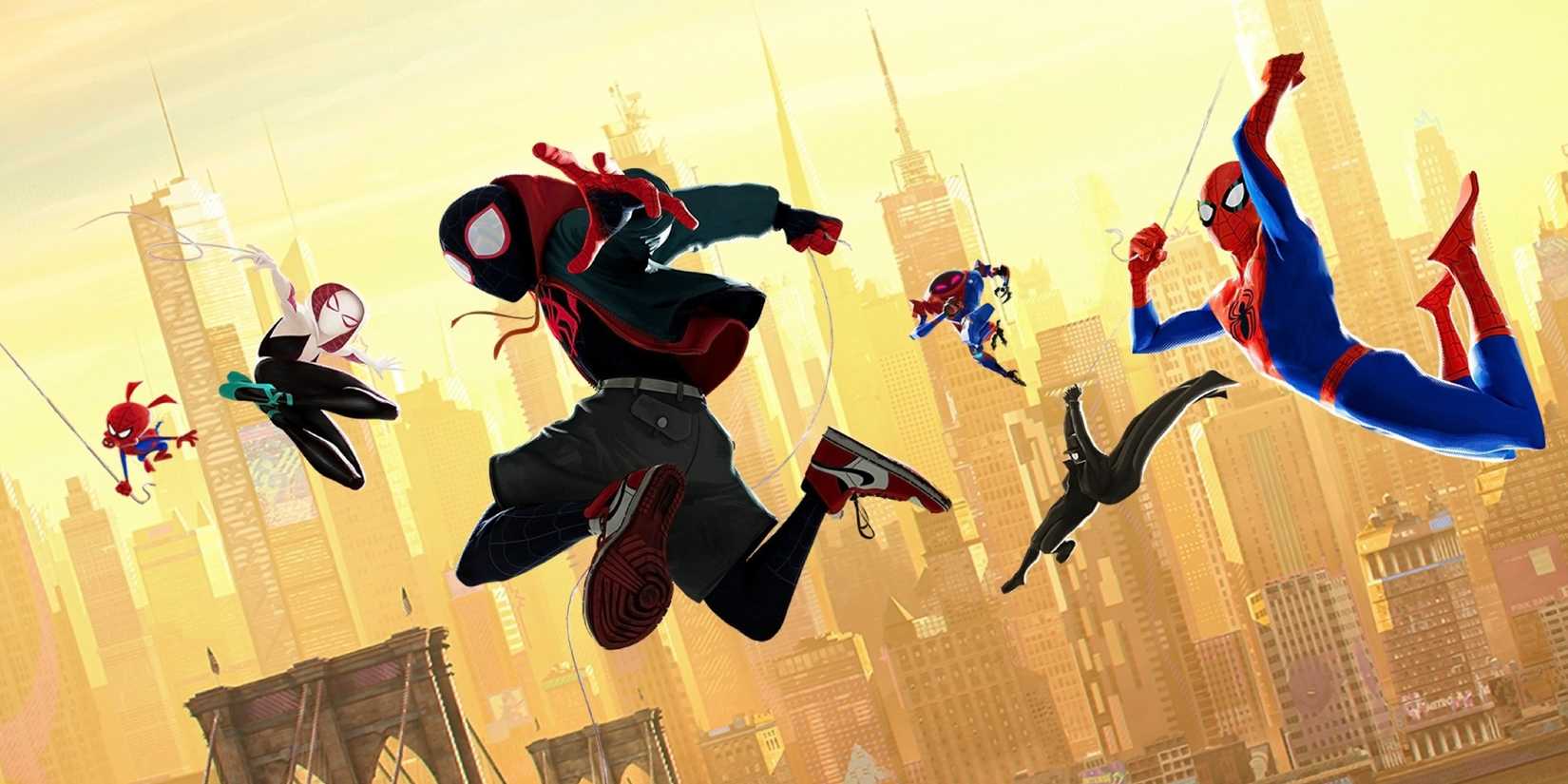 Several versions of Spider-Man swing from webs above a city in Spider-Man: Into the Spider-Verse, 2018.