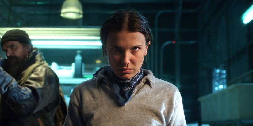 Eleven (Millie Bobby Brown) stares ahead angrily with blood from her nose in Stranger Things Season 5.