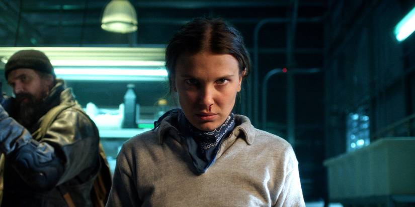 Stranger Things 5 Millie bobby brown staring seriously into the camera.