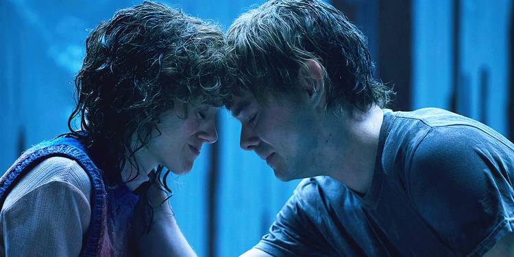 Natalia Dyer and Charlie Heaton holding each other and pressing their foreheads to each other in the trailer for Stranger Things Season 5