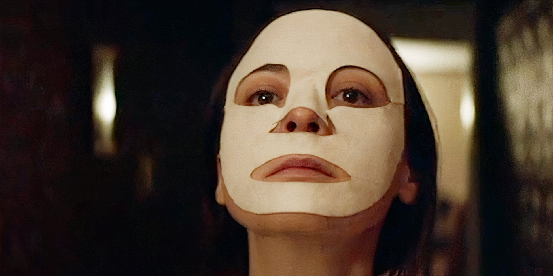A close-up of a woman's face with a calming mask on it in The Antenna 