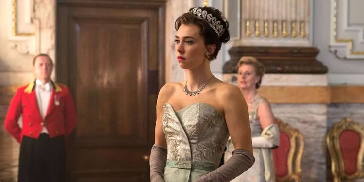 Vanessa Kirby as Princess Margaret in a silver gown with a composed expression on her face in The Crown.