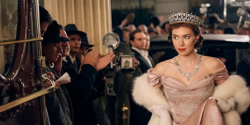 Vanessa Kirby as Princess Margaret, smirking at the paparazzi in a ballgown and a tiara while entering a hotel, in a still from 'The Crown.'
