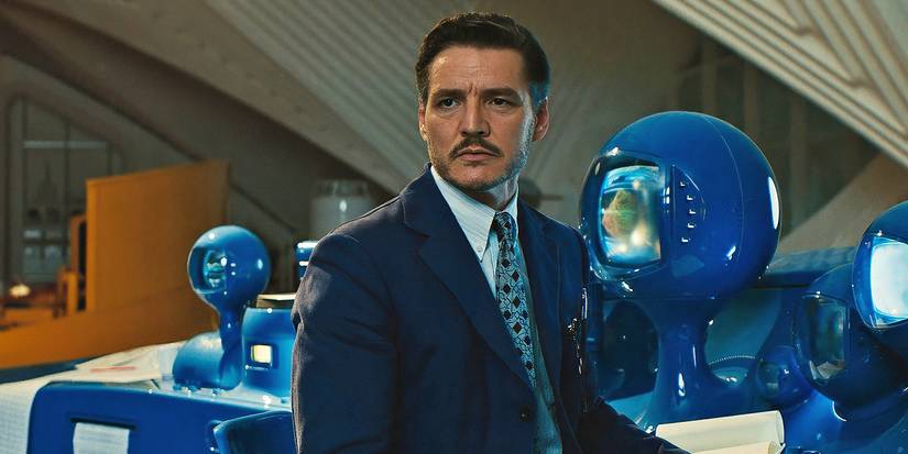 Pedro Pascal as Reed Richards in The Fantastic Four: First Steps standing in front of some interesting technology.