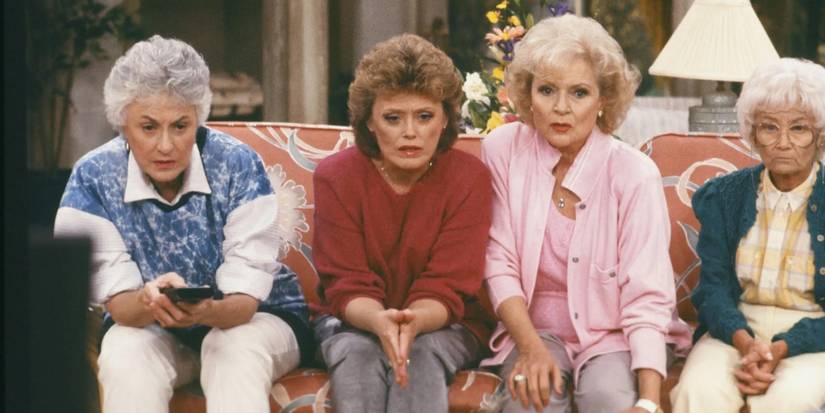 Bea Arthur, Rue McClanahan, Betty White, and Estelle Getty watch TV on The Golden Girls.